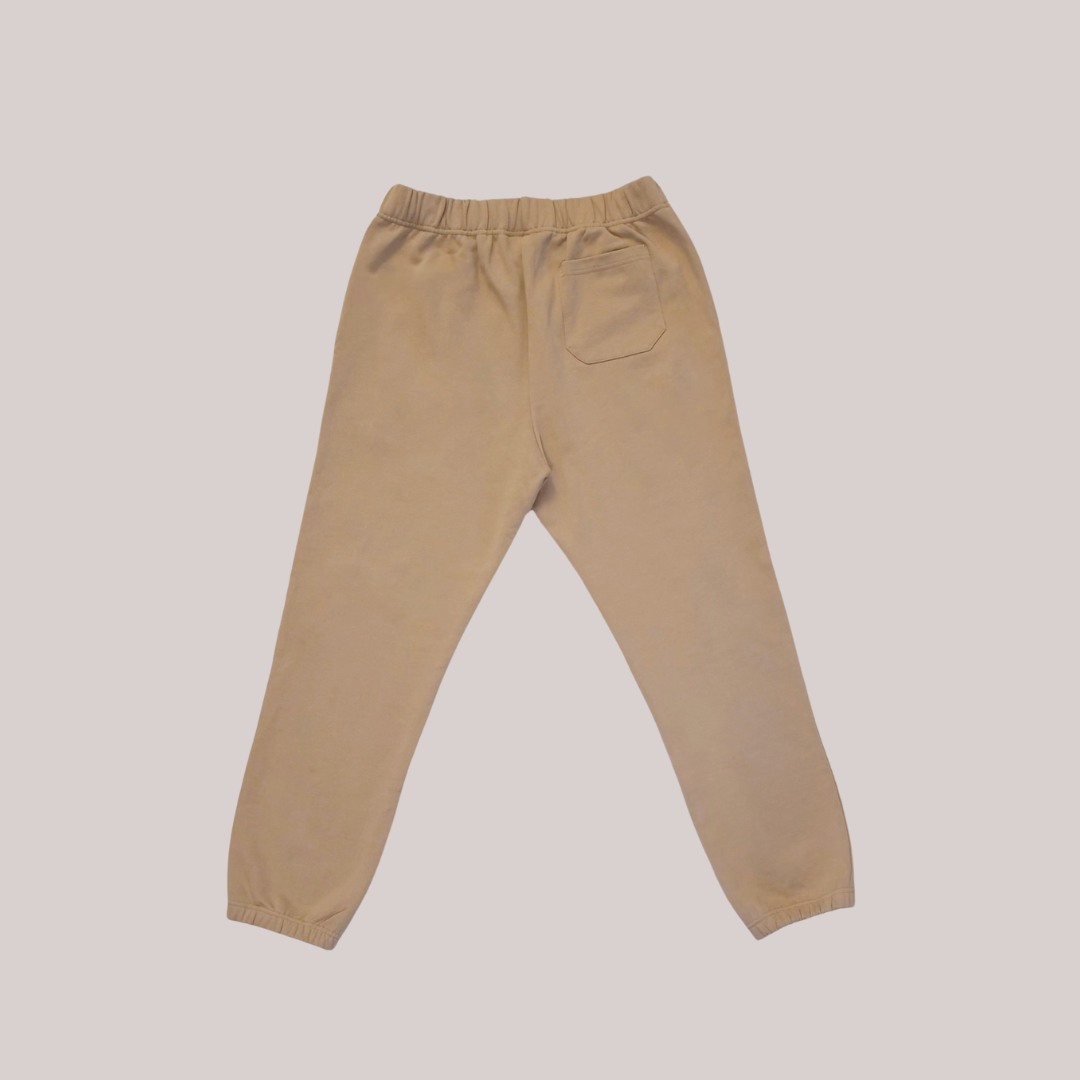 Ox Season Beige Sweatpants back – Athletic joggers with a minimalist 'Ox Season' logo on the upper left thigh. Comfortable and stylish fitness wear for training and casual wear.