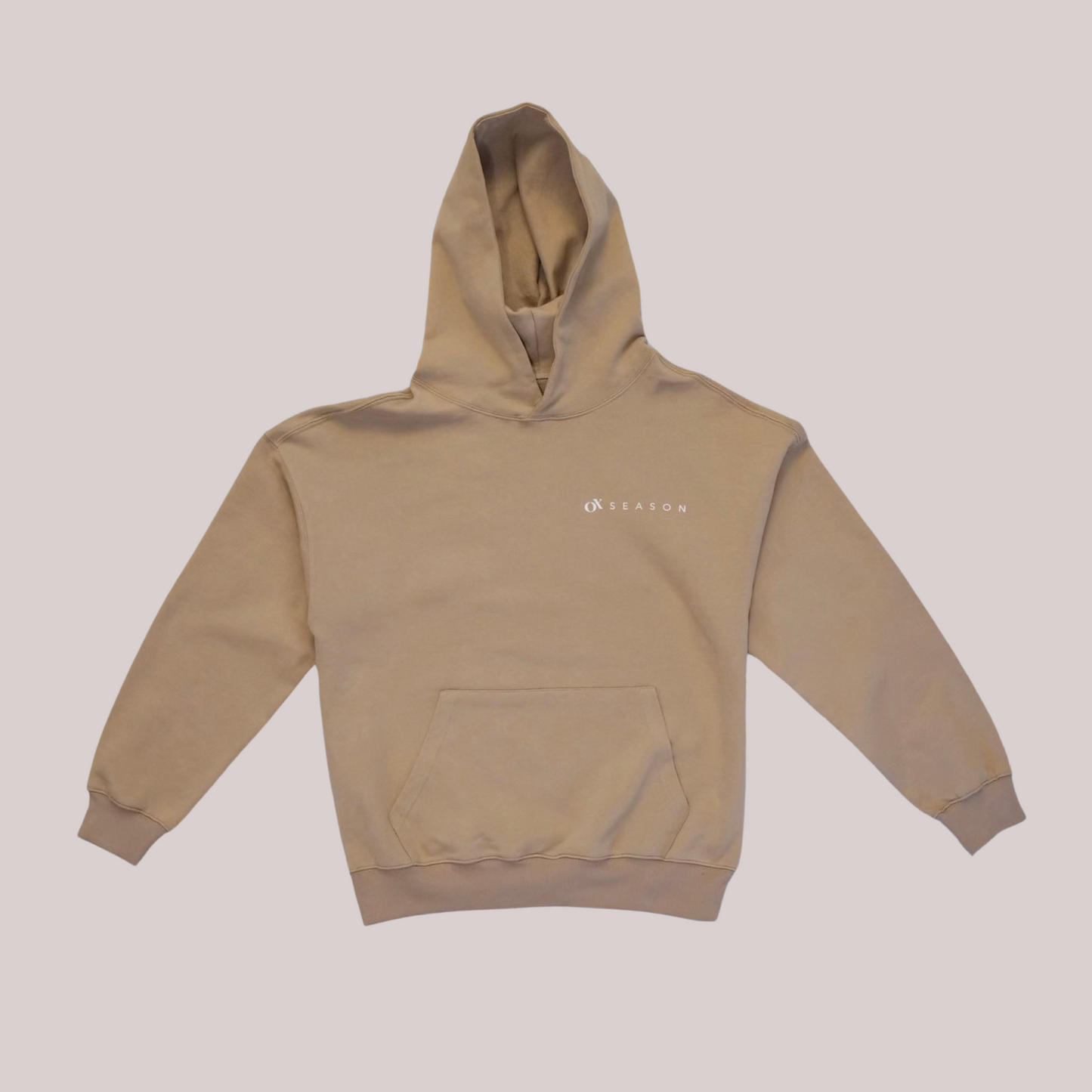 Ox Season 'Training Squad' Hoodie – Beige athletic hoodie with bold white text on the front, featuring 'Ox Season' branding. Premium fitness apparel for gym enthusiasts and athletes